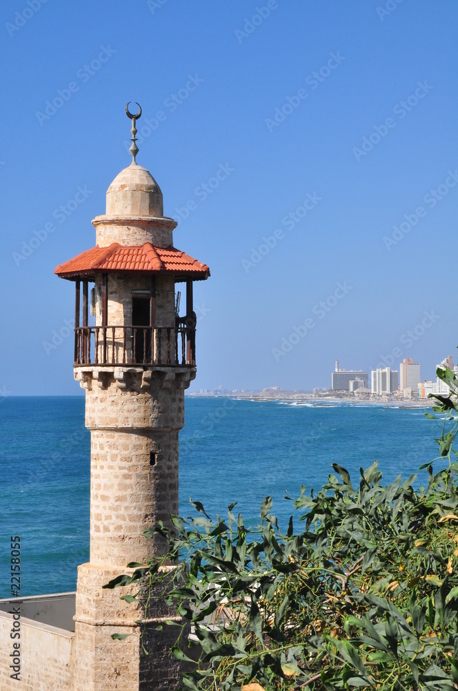 The minaret of the Jaffa mosque with tel aviv coastline at the background. The minaret of the Jaffa mosque with tel aviv coastline at the background.