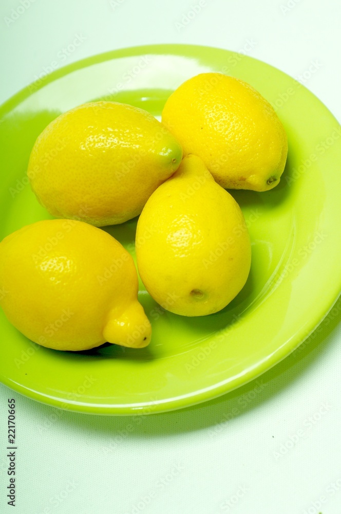 lemons on green plate