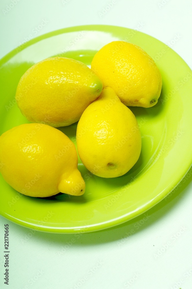 lemons on green plate lemons on green plate