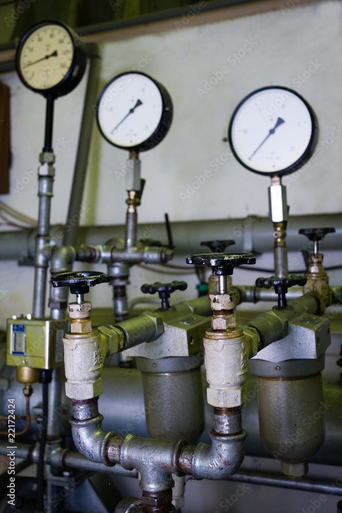 Industrial faucets and manometers in factory Industrial faucets and manometers in factory
