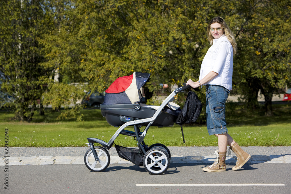 woman with pushing a pram