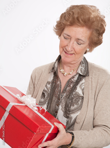 Mature woman receiving a gift