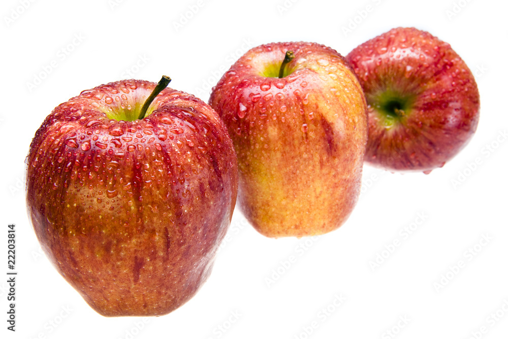 Three juicy apples n drops of water lay ion white background Three juicy apples n drops of water lay ion white background
