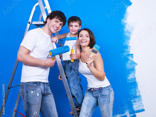 Happy family with paintbrush