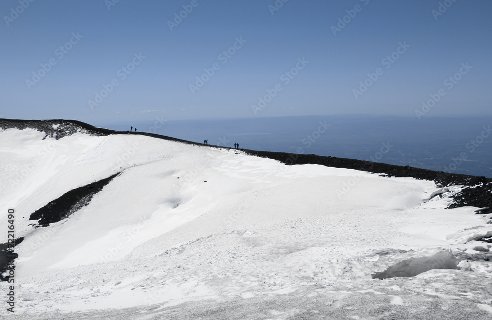 People on volcano mount Etna crater