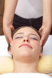 Young woman receiving head massage