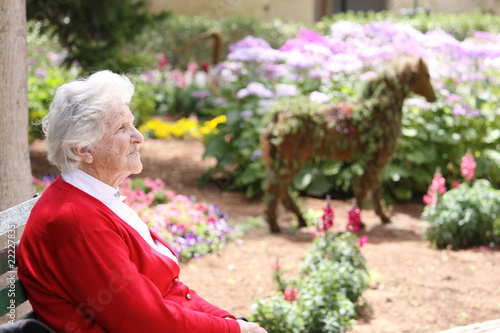 elderly woman sitting in the sun © Frantab