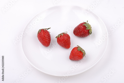 Fresh strawberry on white plate