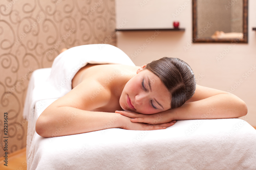 Woman ready for massage in a spa setting Woman ready for massage in a spa setting