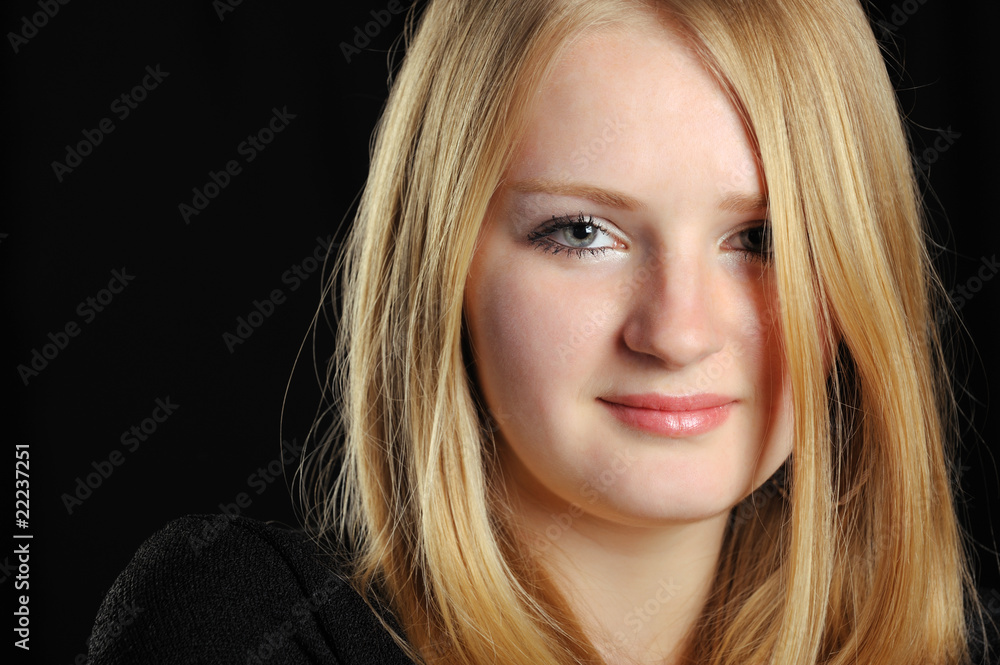 Portrait of the pretty young girl of the blonde