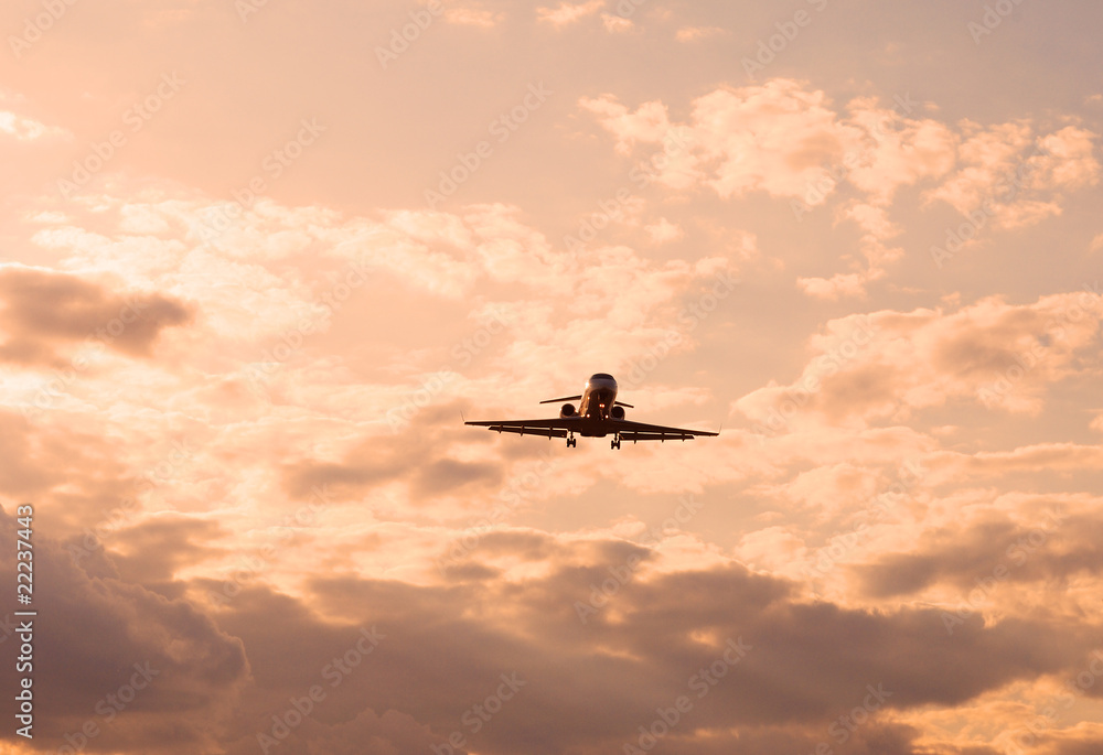 landing plane at sunset