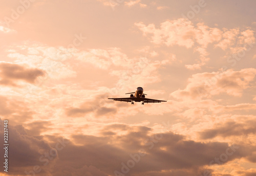 landing plane at sunset