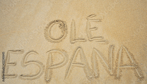 Ole España escrito en la arena