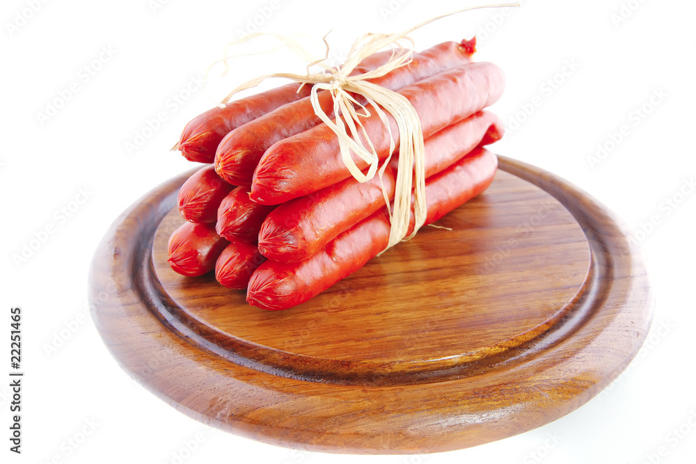 sausages on wooden plate
