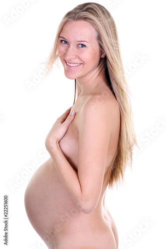 undressed pregnant female holding her breasts