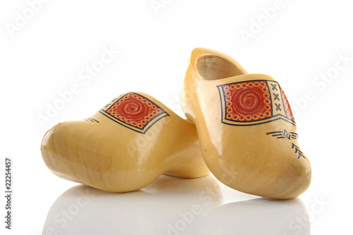 Pair of traditional Dutch wooden shoes over white background