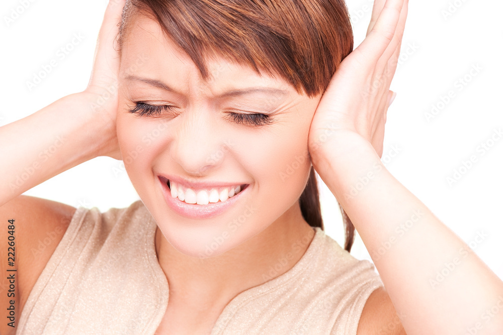 unhappy woman with hands on ears unhappy woman with hands on ears