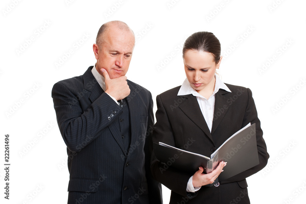 pensive business colleagues looking at report pensive business colleagues looking at report