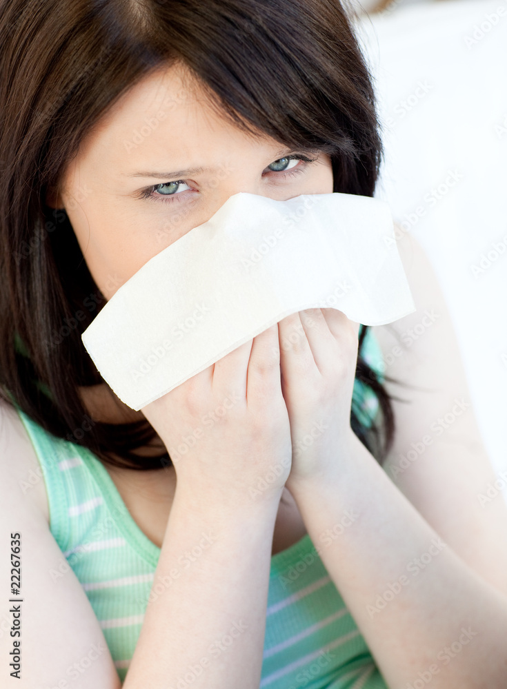 Portrait of a sick caucasian teen girl blowing Portrait of a sick caucasian teen girl blowing