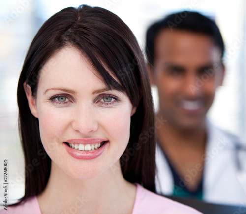 Close-up of two smiling doctos