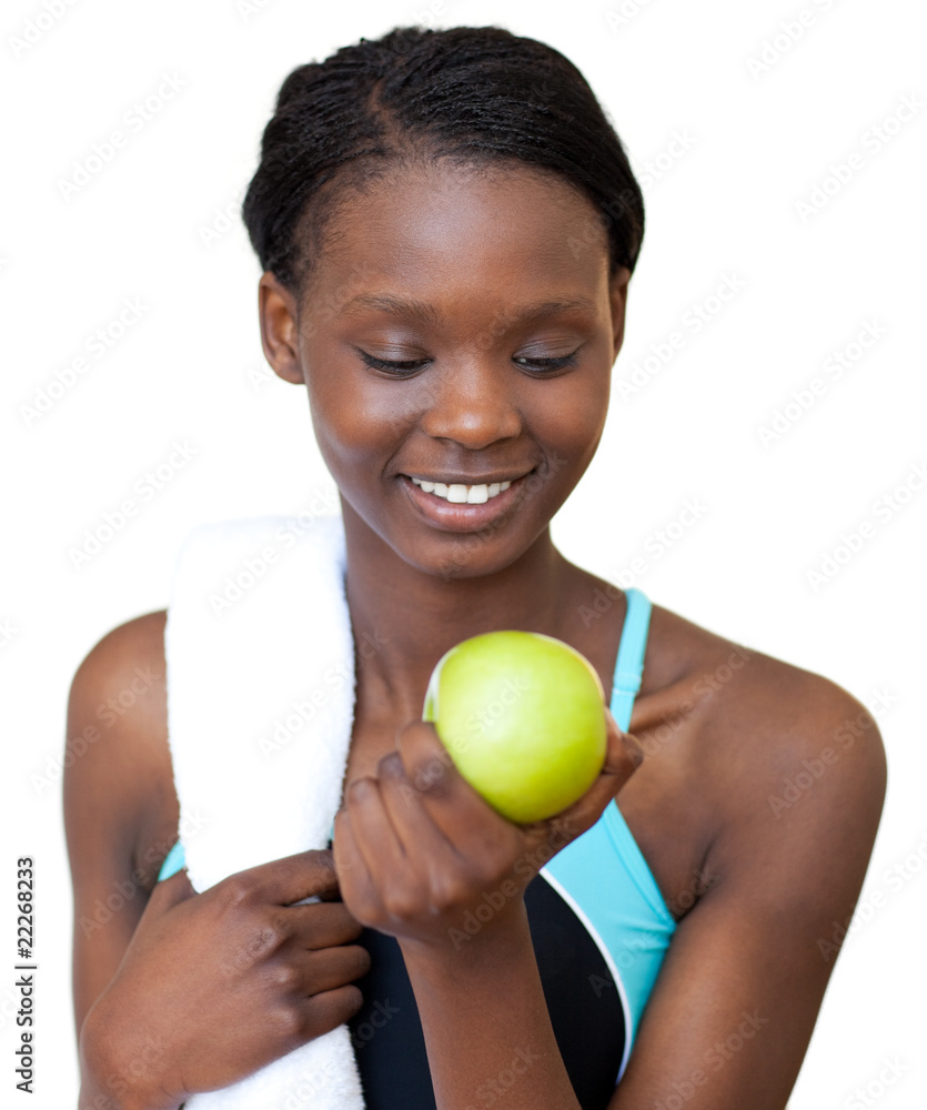 Fototapeta premium Young fitness woman eating an apple