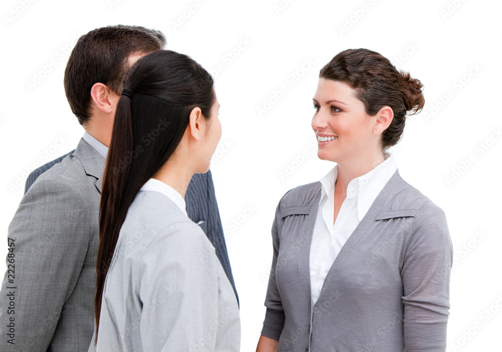 Young business people interacting standing Young business people interacting standing