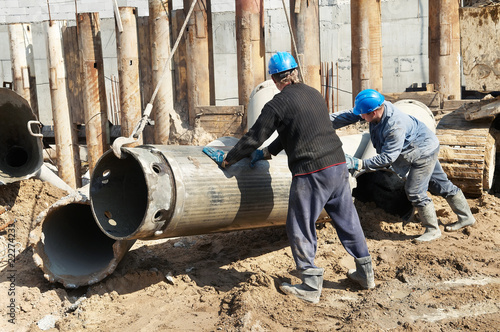 builders with equipment for piling photo