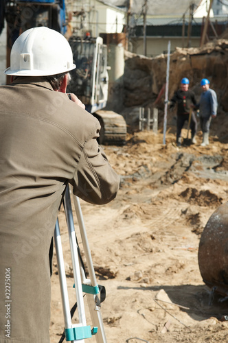 surveyor at construction work