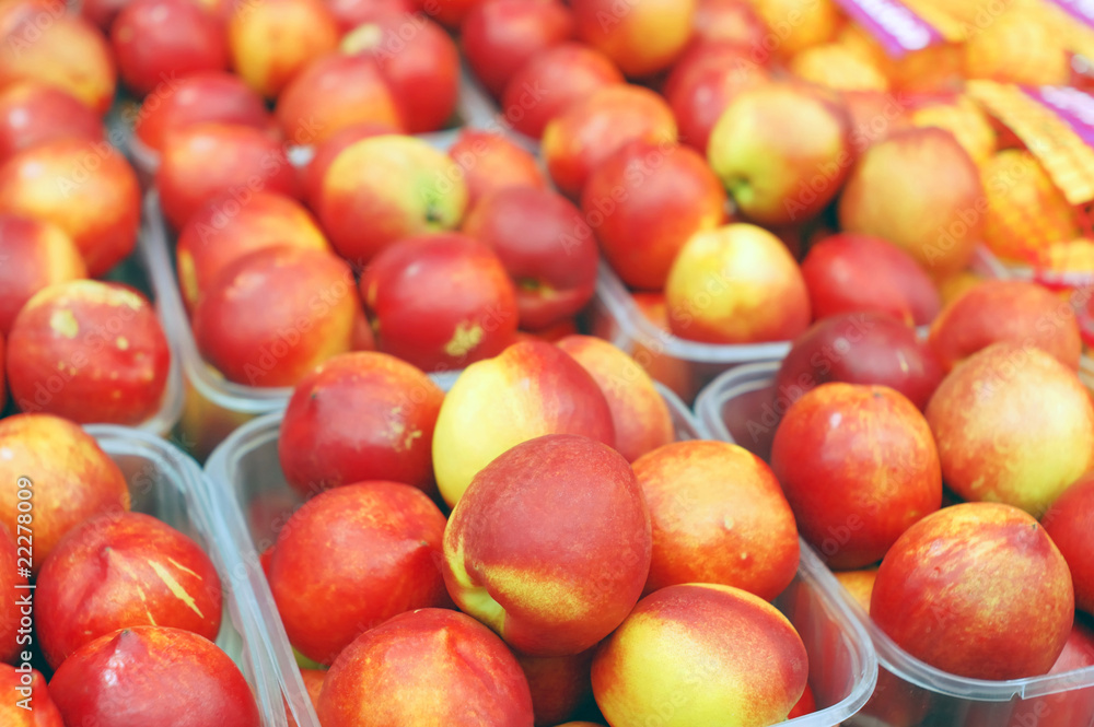 close up of nectarines on market stand