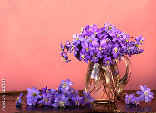 bouquet of flowers in the spring primroses glass pitcher