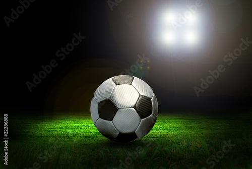 Soccer ball on the field of stadium with light © Andrii IURLOV