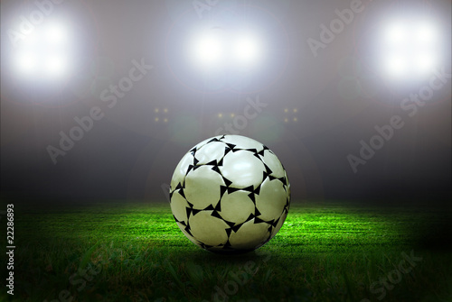 Soccer ball on the field of stadium with light