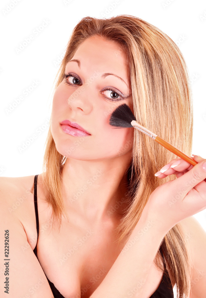 Beautiful young woman face with  applying natural beauty make-up