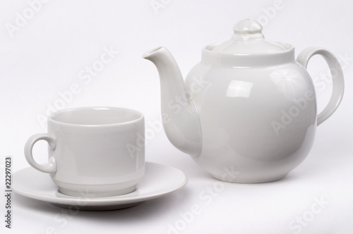 Little white tea cup and a kettle