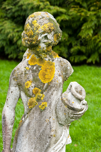 statue with lichen