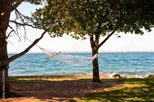 Fototapeta Naklejka Na Ścianę i Meble -  A hammock on a sunny beach