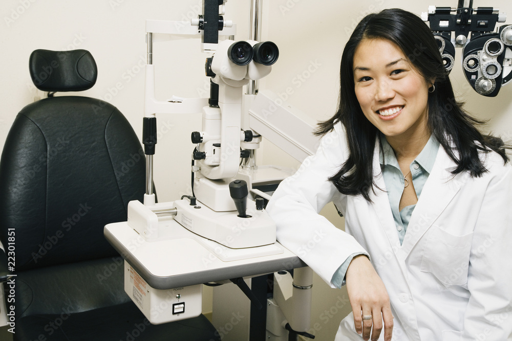 Asian female optometrist in office Asian female optometrist in office