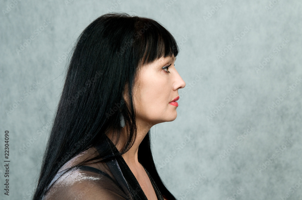 Profile of the woman in a black dress Profile of the woman in a black dress