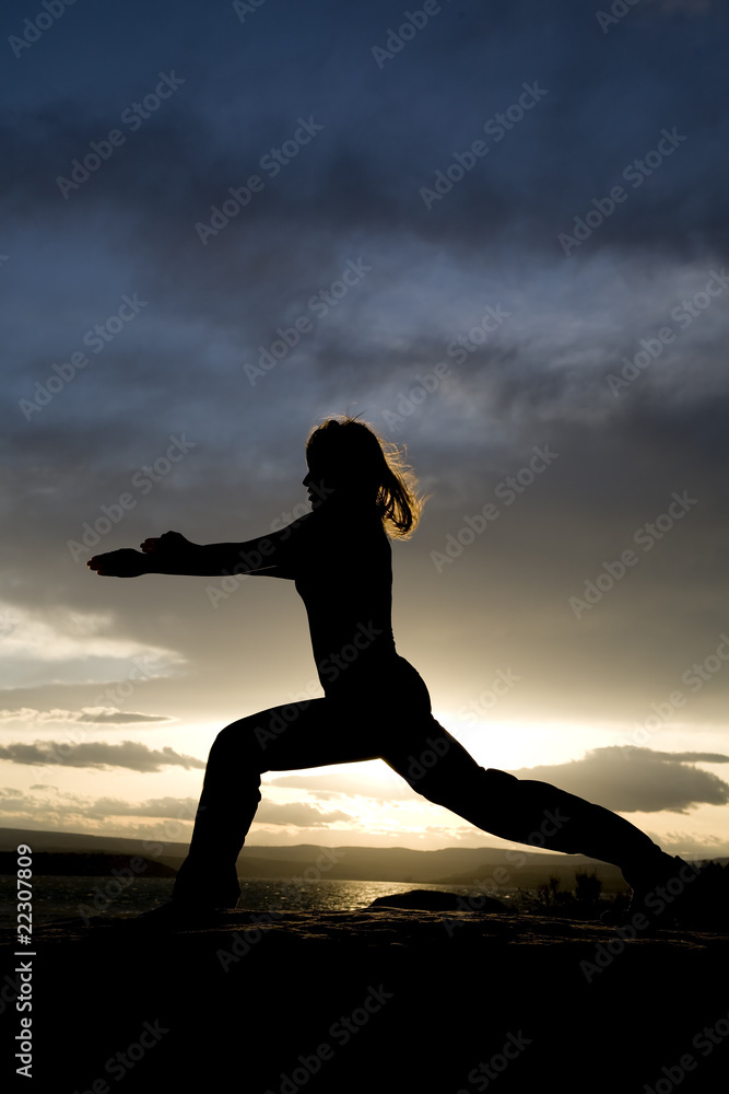 woman silhouette doing yoga