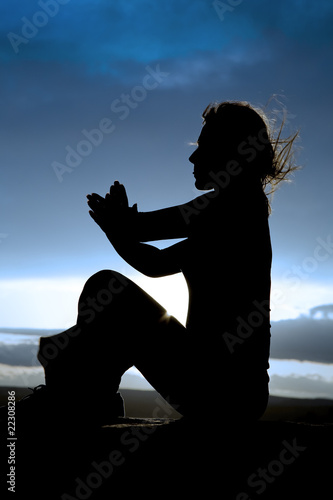 silhouette woman sitting sideways yoga