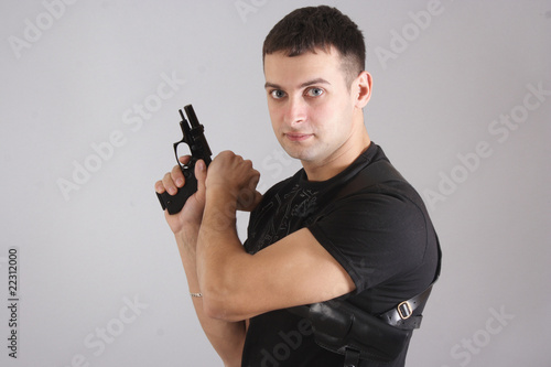 young man with a gun