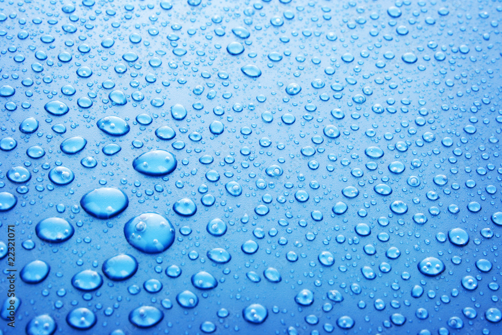 Blue water drops background with big and small drops Blue water drops background with big and small drops