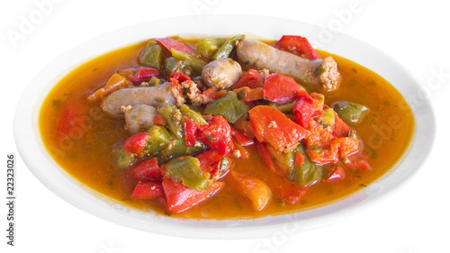 Sausages and Peppers in Tomato Sauce on white dish.