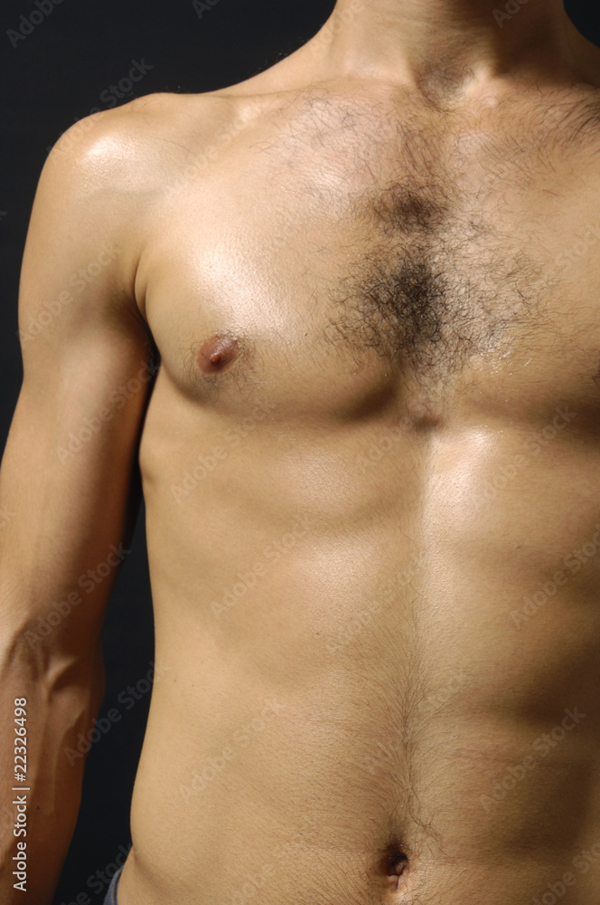 Fototapeta premium An attractive man with a great body in studio