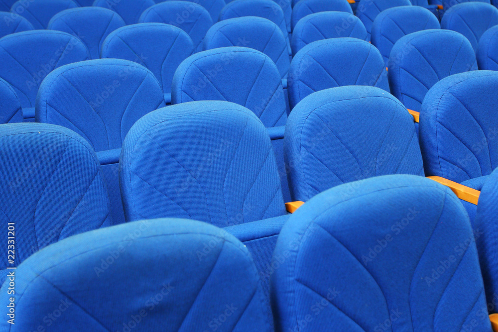 Obraz premium Closeup of blue armchairs backs in conference hall