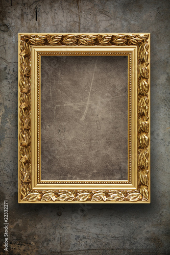 Dark, grungy wall with gold frame
