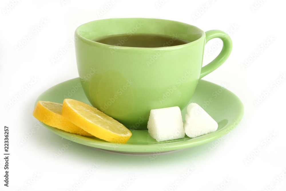 Cup of tea with lemons and lumps of sugar Cup of tea with lemons and lumps of sugar