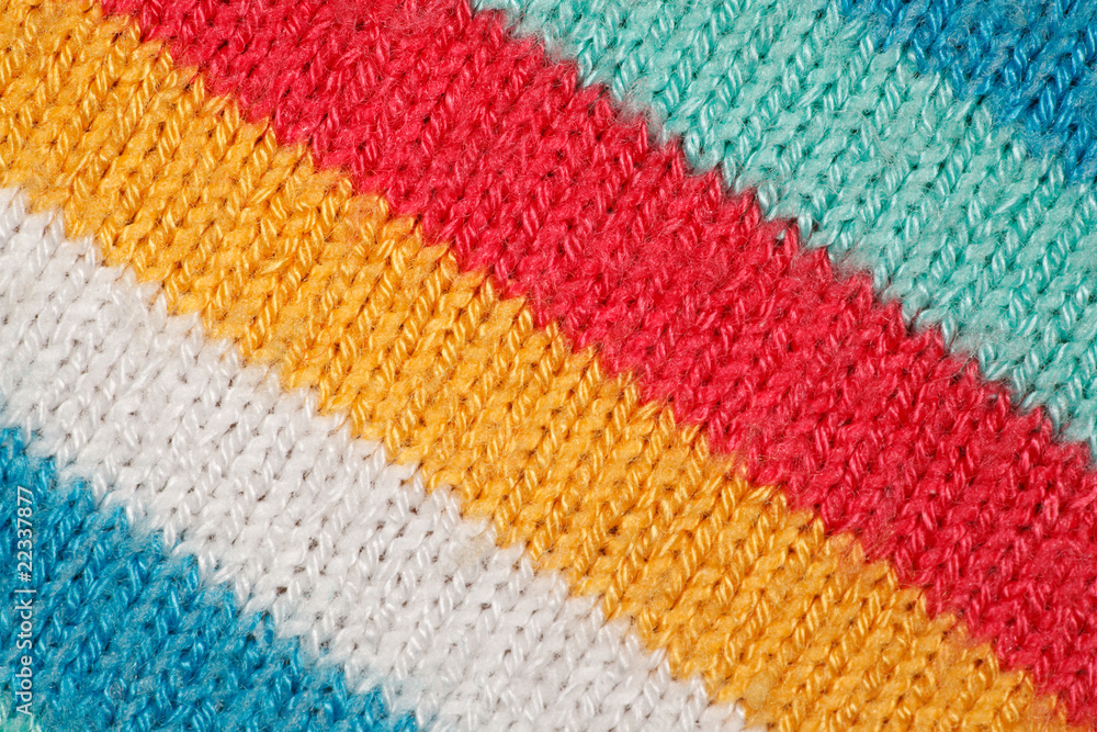 Structure of fabric close up. Bright colored strips on diagonal.