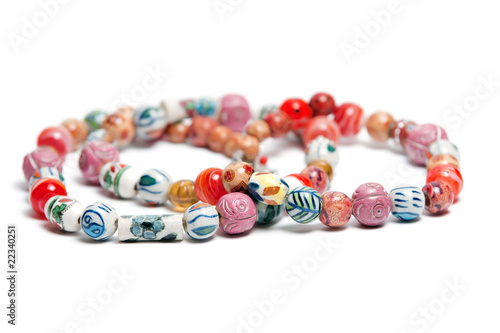 A necklace with beads in varius colors and patterns