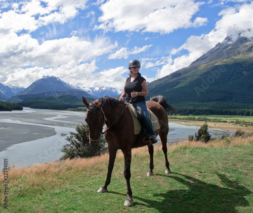 Girl riding horse in New Zealand